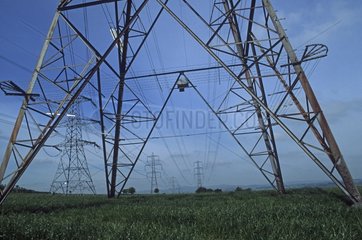 Electricity pylons in open countryside near Paisley Scotland