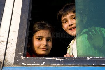 Two young Boys passengers on a bus Uttar Pradesh India