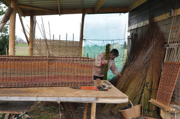 Making off a Wicker coffin for organic funeral