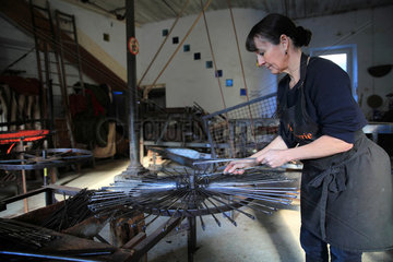 Frederique Fert installing the machine used to make a scourtin  Nyons  Provence  France