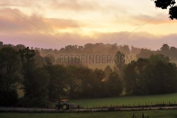 Tractor on country road at dawn Basque Country France