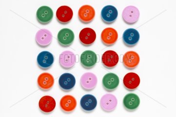 Buttons of colors to 2 holes in square