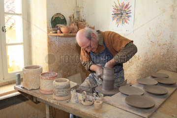 Potter working on a clay piece  Martine Gilles and Jaap Wieman  Village of Brantes  Provence  France