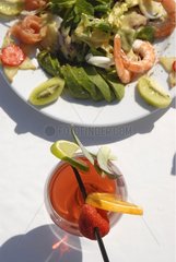Colorful cocktail and a salad on a table Ibiza