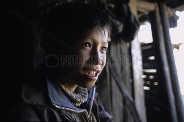 Portrait of a Yi child Yunnan China