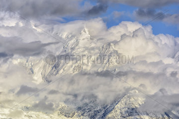 Bionnassay needle under clouds at dusk on a stormy evening  Mont Blanc Massif  Alps  France