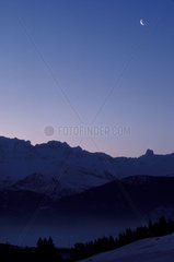 Crescent moon above the Alps Hautes-Alpes