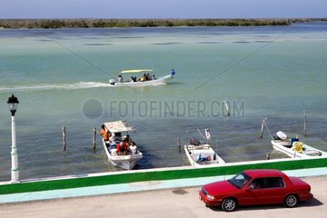 Car on the quay of a lacuna Mexico