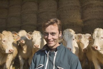 Stockbreeder and his herd of cow charolaise
