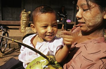 Portrait of a child in mother's arms Myanmar