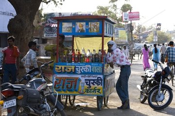 Drinks salesman in a street Uttar Pradesh India
