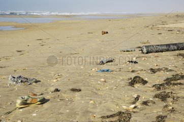 Sandy beach on the Atlantic coast of oily waste