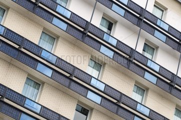 Photovoltaic panels on the railing of the hotel