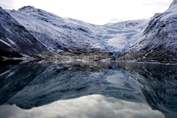 Glacier Svartisen reflecteding in North Sea Norway