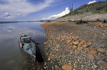 Kayak on Mackenzie riverbank Canada