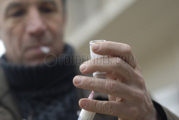 Veterinary surgeon taking in an antibiotic bottle