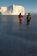 Hikers on the Ice floe in Terre Adelie Antarctic