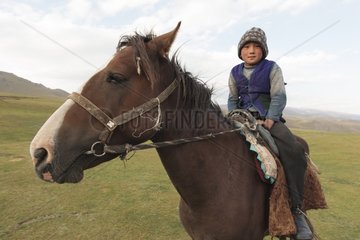 Kyrgyz boy on his horse - Kyrgyzstan