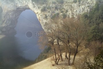 Mist over a natural arch in the Gorges of Ardèche France