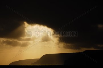 Sumbeams and clouds at sunset above Auckland Islands