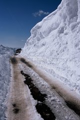 Gigantic snow-drift in edge of road Auvergne France