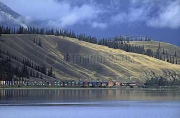 Freight Train on a lake Rocky Mountain Alberta Canada