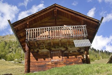 Alpine chalet and solar panel Val of Hérens Alps Swiss