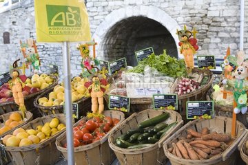 'Organic' fruits and vegetables on a grocery stall Bonnieux
