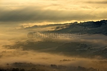 Mists of Savoyard countryside at dawn - France