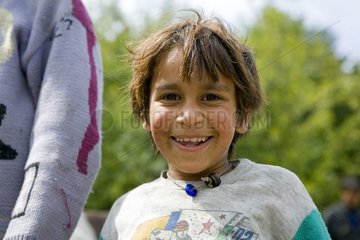 Gypsy child portrait in forest Bulgaria