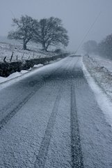 Road covered with snow in spring Plateau of Aubrac France