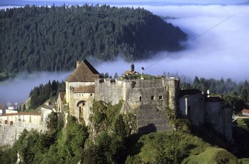 Fort of Joux rising out of the fog Doubs France