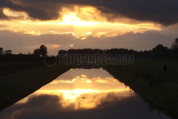 Sunset above a channel Weerribben NP Netherlands