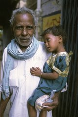 Young girl carried by her grand-father Varanasi India
