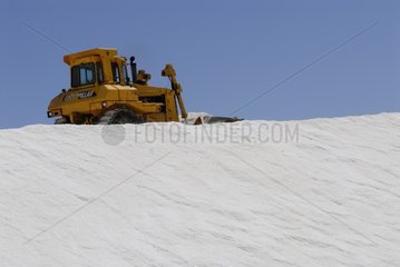 Bulldozer working on a salt mountain