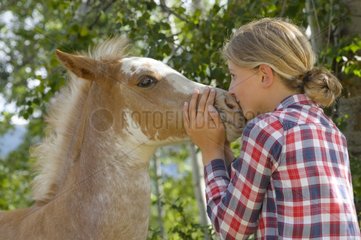 Young girl and Quarter Horse cross Pinto - Canada Rockies
