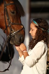 Girl harnessing his horse - Senegal