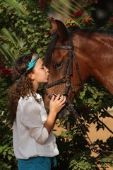 Young girl cuddling her horse - Senegal
