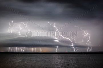 Storm on the estuary of the Gironde night in summer - France