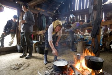 Preparation of the polenta in a herdsman house Romania
