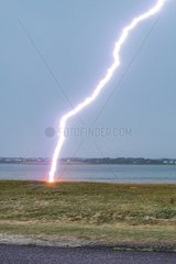Lightning strike on the shore in summer - Brittany France