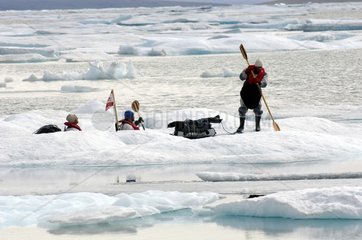 Release of ice to pull a kayak off a bay Canada