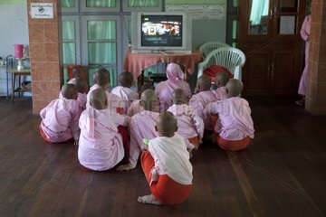 Nuns watching TV in Nyaung Shwe in Burma