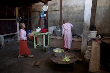 Nuns cooking dinner in monastery Nyaung Shwe in Burma