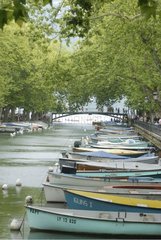 Mourring boats side-by-side along a canal in Annecy