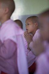 Prayer meeting in a Buddhist monastery in Burma