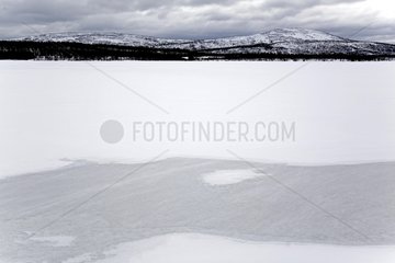 River appearing under the ice in spring Norway