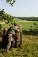 Hunter firing position behind a millstone France