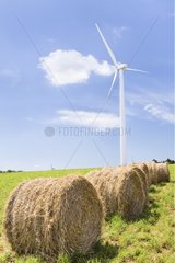Aeolian in a field and rolls of hay in summer France