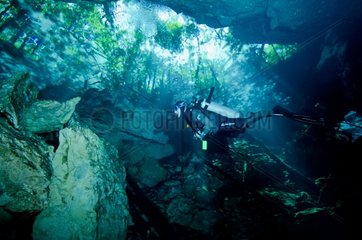 caver diver in Cenote of Chahakmol Yucatan Mexico